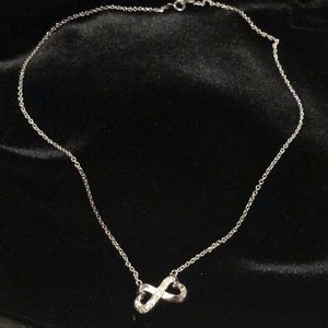 Silver tone infinity necklace